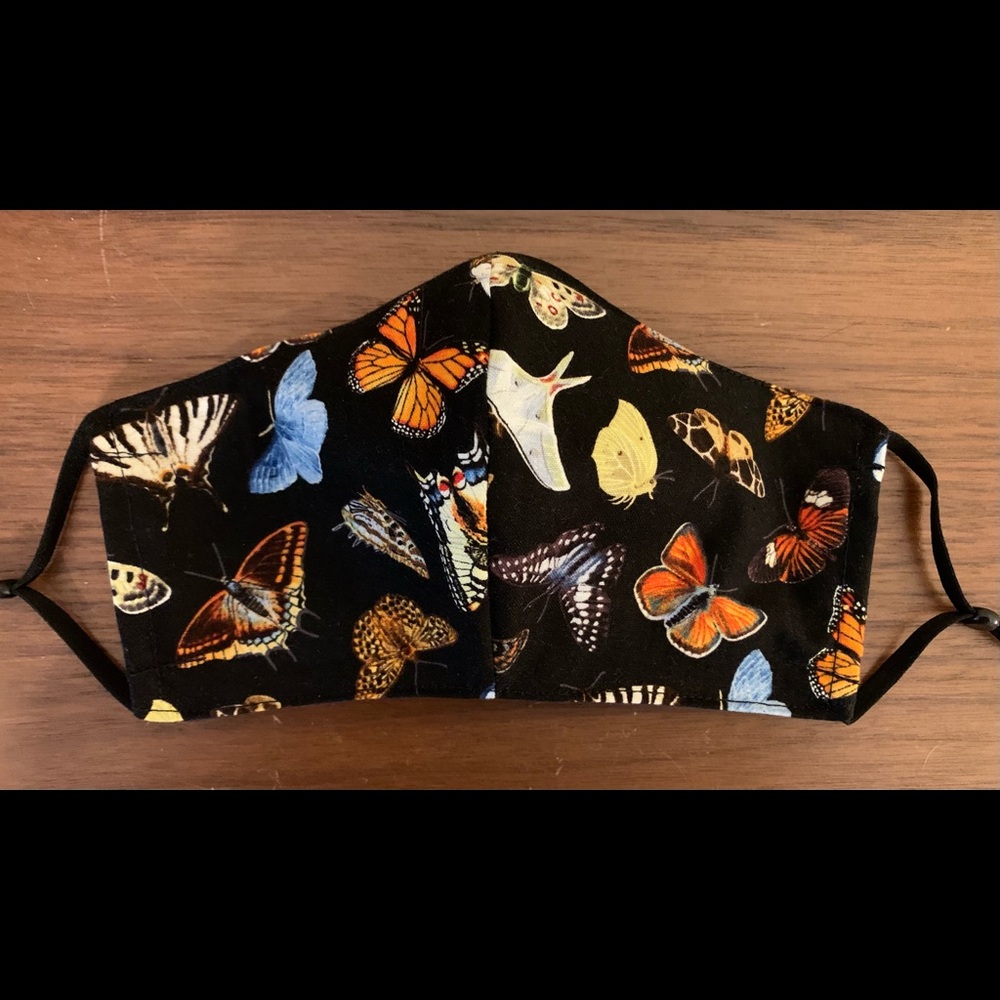 Fitted Butterflies mask with filter pocket, nose wire and adjustable ear loops.